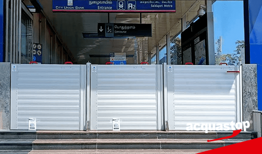 Industrial bay opening with heavy mechanical flood gate — deployment view 2